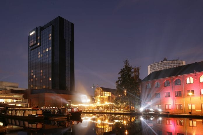 Hyatt hotel standing over Gas Street Basin with canals and barges, Birmingham